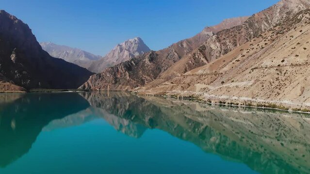 Aerial view Iskanderkul Lake, Fann mountains, Tajikistan, Central Asia.
Mountains and blue sky above
Iskanderkul or Iskander Kul Lake.