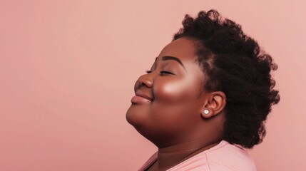 A person with a radiant smile closed eyes and a joyful expression set against a soft pink background with their head tilted back slightly showcasing a side profile view.