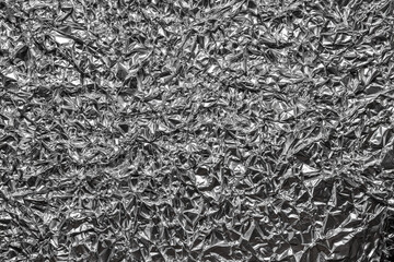 Crumpled shiny metal foil texture