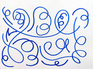 Abstract Blue Pen Doodles on White Paper. Series of whimsical blue ink doodles with loops and...