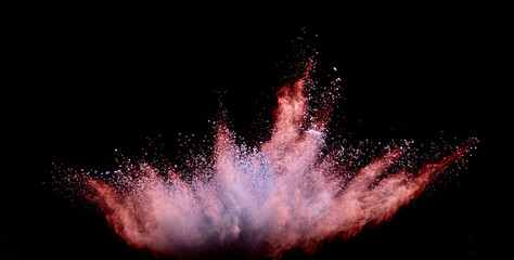 Explosion of red powder dust on a black background