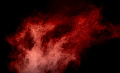 Red powder dust smoke on black background