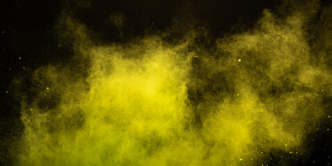 Yellow powder dust smoke on black background - obrazy, fototapety, plakaty