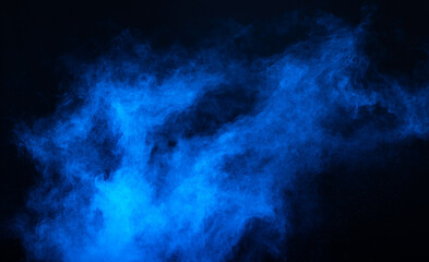 Blue powder dust smoke on black background