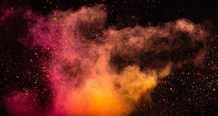 Orange pink powder dust on a black background