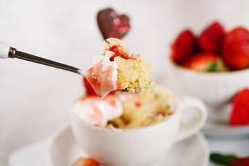 Strawberry shortcake mugcake - Valentines day microwave  cake in a mug for two, selective focus