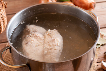 Bone meat chicken broth on the table close-up, rustic style