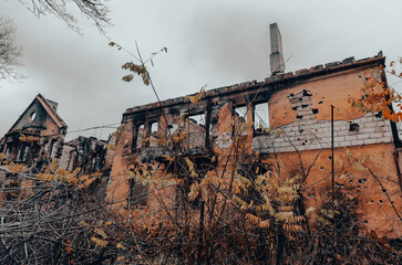 destroyed and burned houses in the city during the war in Ukraine