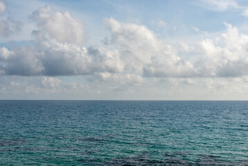 Fototapeta premium white clouds above a blue sea