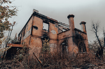 destroyed and burned houses in the city during the war in Ukraine