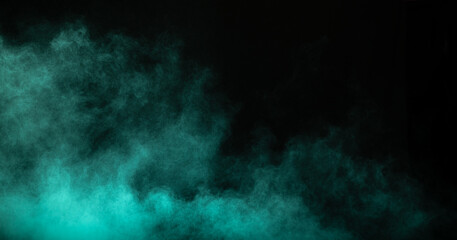 Fototapeta na wymiar Blue powder dust smoke on black background