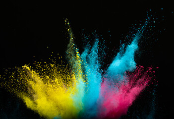 Explosion of colored multi-colored powder on a black background