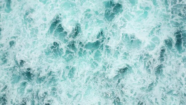 Drone takeoff over the spectacular waves of the ocean. Video background of the waves.