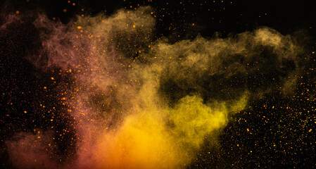 Fototapeta na wymiar Yellow pink powder dust on a black background