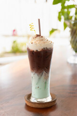 Chocolate mint latte with iced and whipping cream on top. Mint Choc is a nick name of drink.