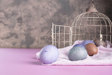 Easter background with naturally dyed Easter eggs.  Blueberry dye.