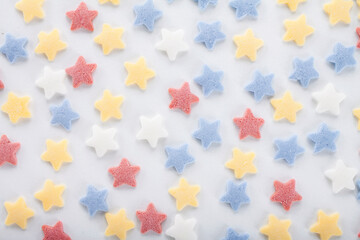 Colorful sugar sprinkles on white background