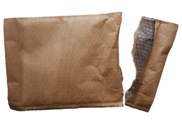 Postal envelope made by craft paper. Opened shipping envelope. Delivery and postal concept graphic material. Shipping packaging materials.