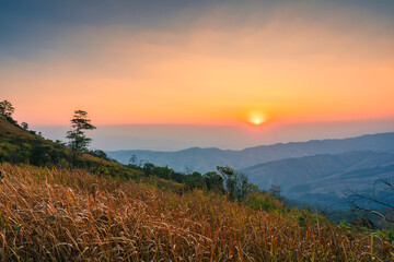 Sunrise over mountain in tropical rainforest at Phu Lom Lo, Phu Hin Rong Kla national park