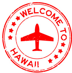 Grunge green welcome to word hawaii with plane icon round rubber seal stamp on white background