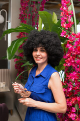 An brunette woman eats ice cream with pleasure.,