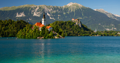 Panoramic view of Lake Bled in Slovenia, a popular tourist attraction with famous pilgrimage church...