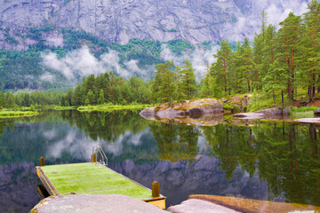 Platform on Otra River flowing through a beautiful mountain landscape around Valle, Norway - 730997645