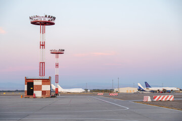 Lighting towers and airplanes at the airport