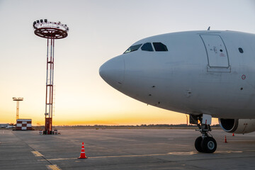 Lighting towers and airplane at the airport