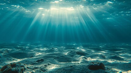 Fototapeta na wymiar Underwater ocean texture with sunlight filtering through background