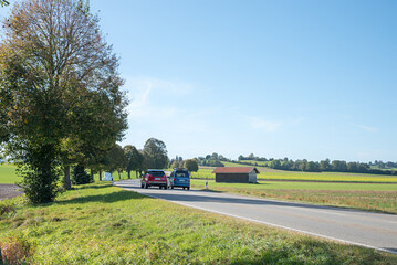 Overtaking maneuvers on the country road to Bad Tolz - obrazy, fototapety, plakaty