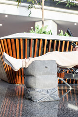 waiting at the airport, departure hall,  Inflatable Travel Foot Rest Pillow