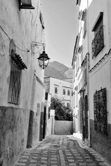 Traditional houses along alleyway in Chefchaouen, Morocco