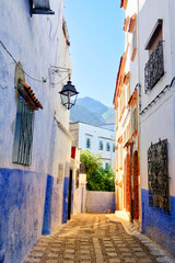 Traditional houses along alleyway in Chefchaouen, Morocco