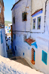 Traditional houses along alleyway in Chefchaouen, Morocco