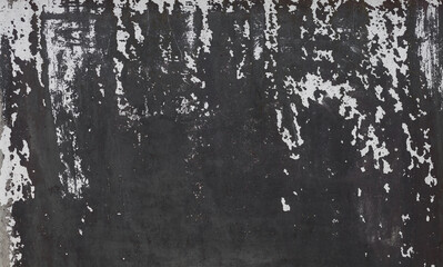 Concrete wall grunge black texture with cracked paint. Old concrete wall background. Concrete wall surface with black and white cracked paint. Close up.