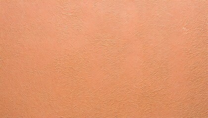 Fototapeta premium Background of embossed texture in peach fuzz color.