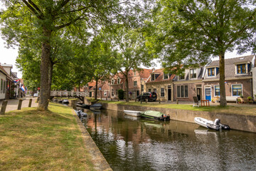 Fototapeta na wymiar Achterom canal in old town of Medemblik, Noord-Holland, Netherlands
