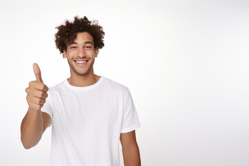 Portrait of a smiling teenager boy wearing casual white t-shirt isolated over white background.