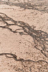 Abstract relief rough gritty neutral beige surface of background texture. Aesthetic pattern on sandstone. Top view textured sand, natural ornament or wallpaper, macro photo shore salt lake