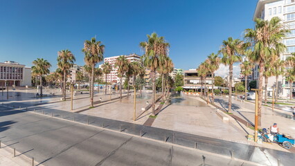 Fototapeta na wymiar Panorama showing aerial view of the fountains and palms on the main square Sheshi Liria in Durres timelapse, Albania