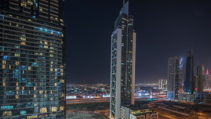 Aerial view of Dubai Downtown skyline with many towers night timelapse.