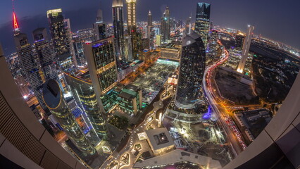 Skyline panorama of the high-rise buildings on Sheikh Zayed Road in Dubai aerial day to night...
