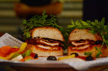Chicken schnitzel in the Challah. Israeli street food. Challah sandwich - sabich. Eggplant, grilled...