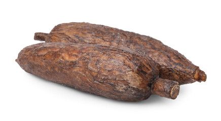 Two whole ripe cassava roots isolated on white