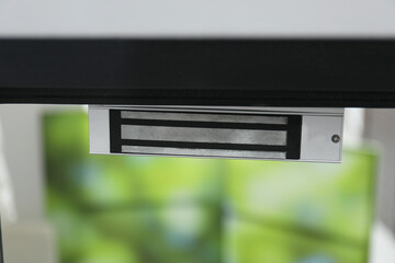 Electromagnetic door lock indoors, closeup. Home security