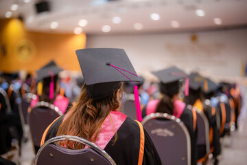 Rear view of graduates at the university graduation ceremony