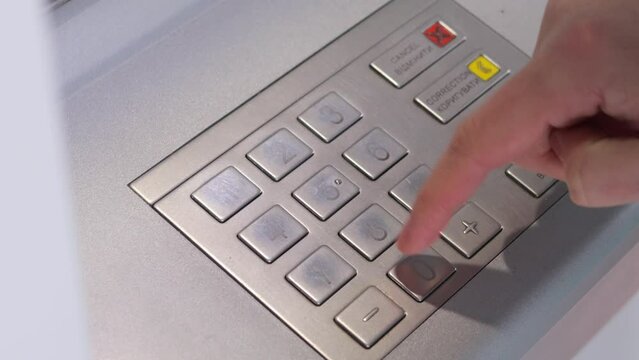 Banking machine operation. Electronic financial transactions. ATM security features. Money withdrawal process. Banking technology trends. Unrecognizable woman pressing ATM EPP keyboard