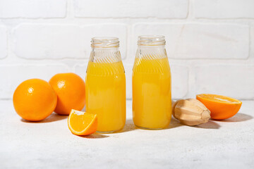 freshly squeezed orange juice in glass bottles