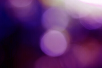 An abstract purple tone background with geometric bokeh created by a graphics program.
